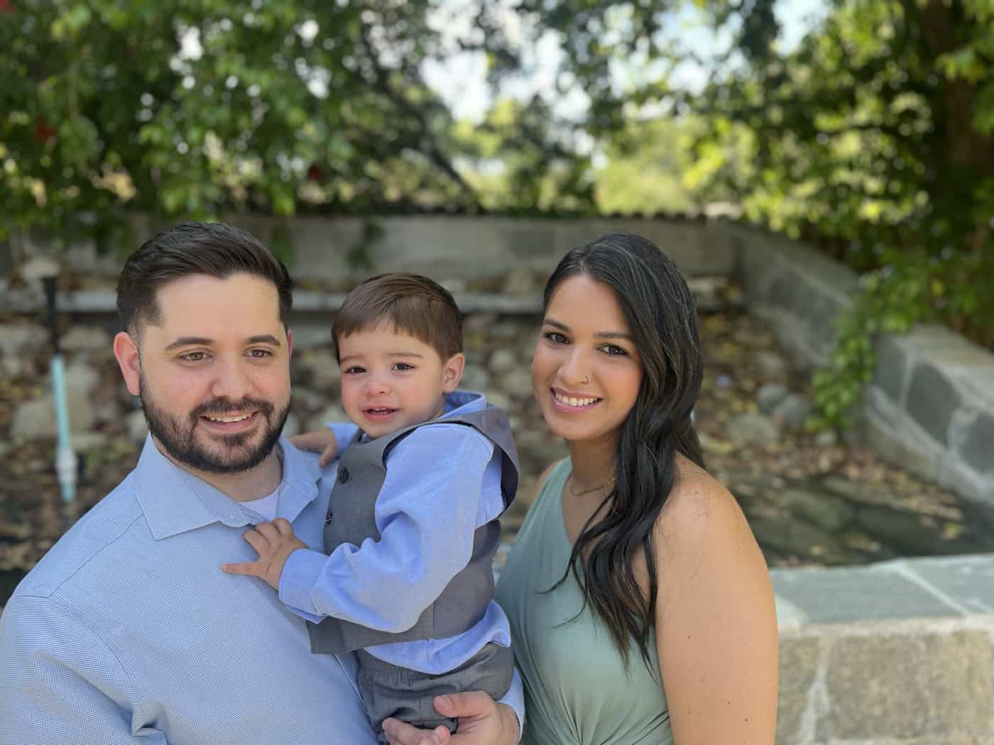 A young family of Santa Clarita United Reformed Church with their toddler outside the church