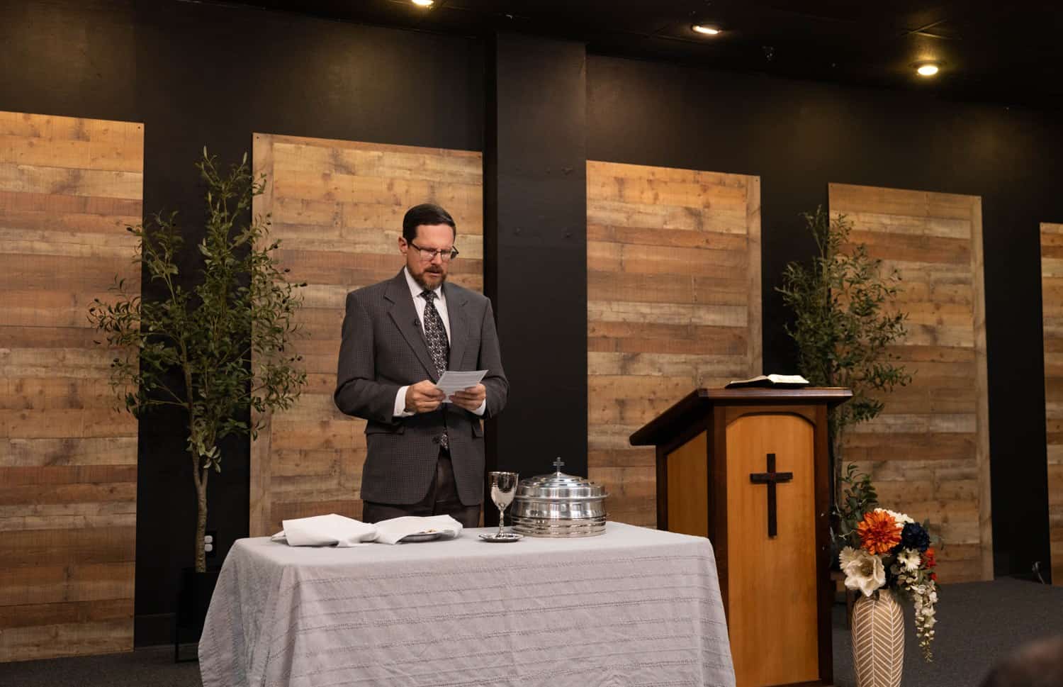 Pastor Lee Irons administering the Lord's Supper at Santa Clarita URC