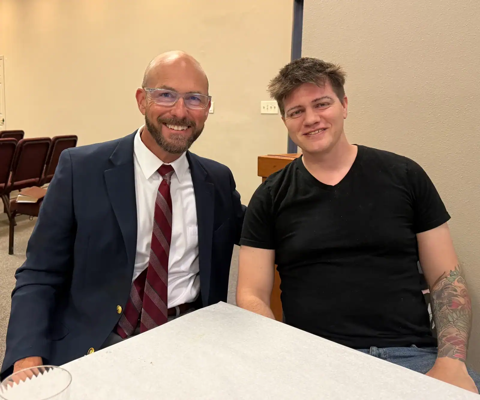 Two members talking together after worship