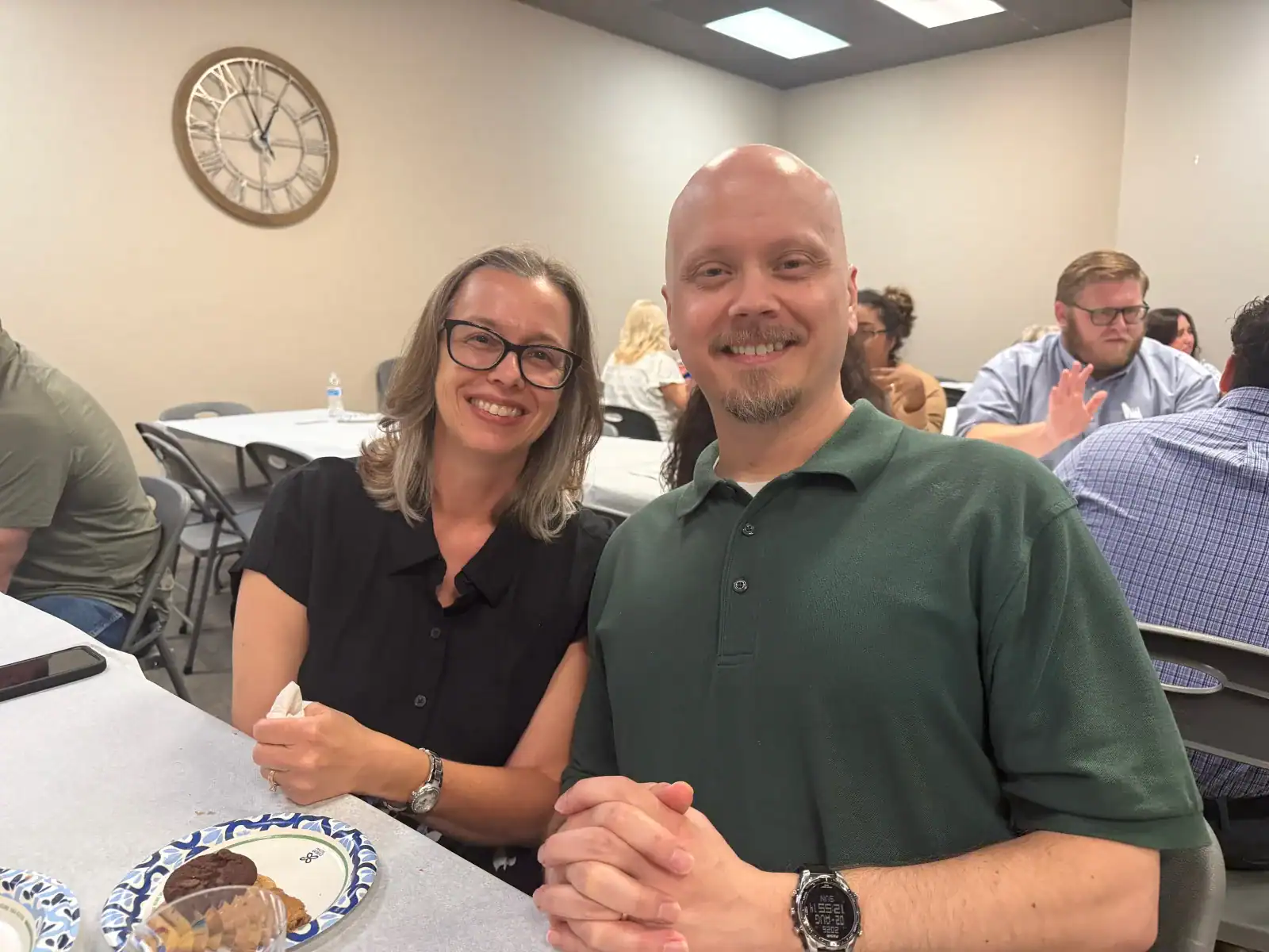 Two members enjoying fellowship at a shared meal