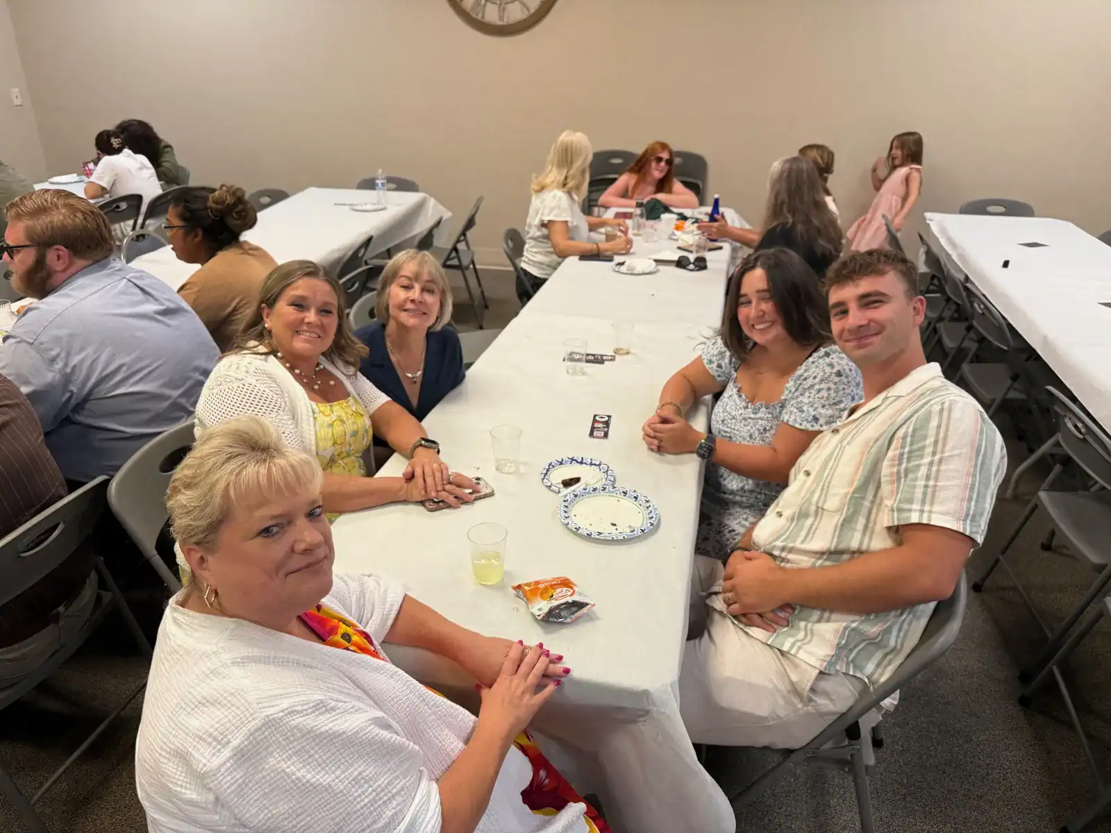 Adults and children enjoying fellowship after worship
