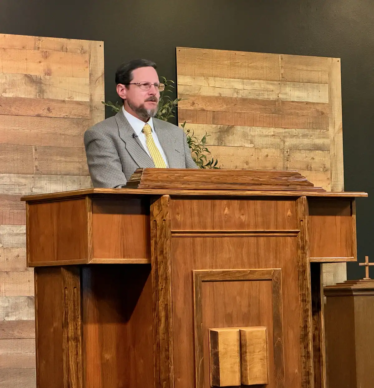 Pastor Lee preaching from the new pulpit at Santa Clarita United Reformed Church